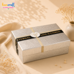 Premium silver embossed gift box with black and gold ribbon design