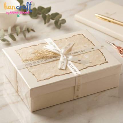 Elegant cream ivory luxury gift box with gold ribbon and dried flower decoration