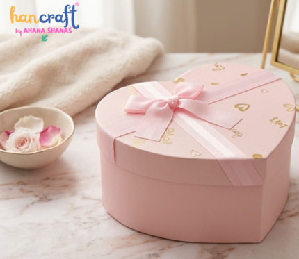 Romantic pink heart shaped gift box with satin ribbon bows